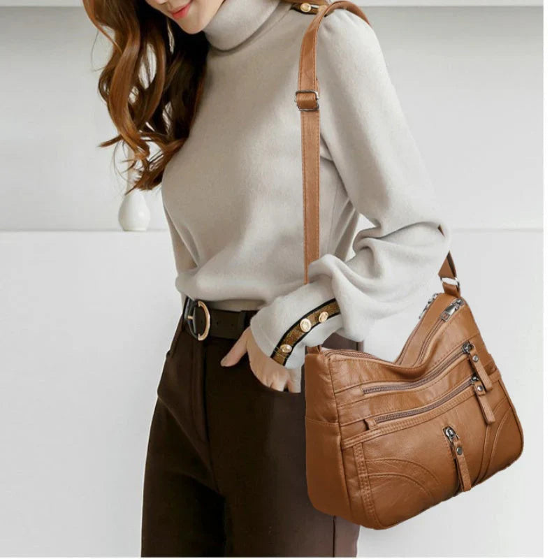 Nerea - Bolso bandolera moderno con múltiples cremalleras y correa ajustable