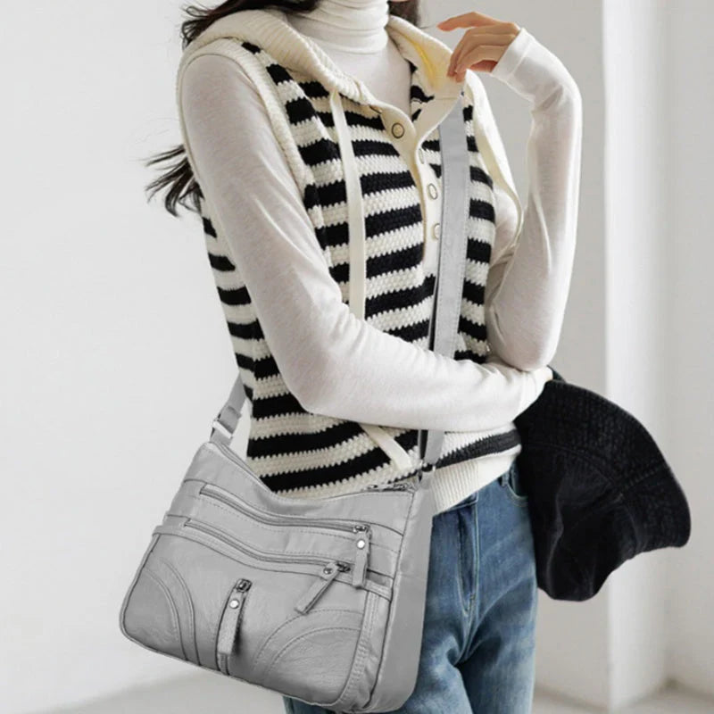 Nerea - Bolso bandolera moderno con múltiples cremalleras y correa ajustable